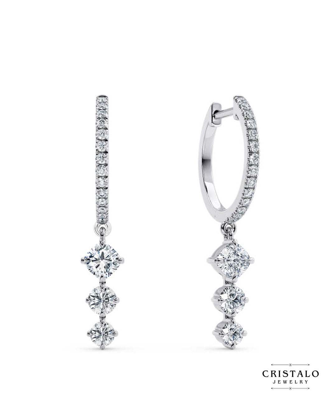 An elegant pair of Lyra earrings, diamond-dusted hoops hung with three linked diamonds, casting a celestial spell wherever they go.