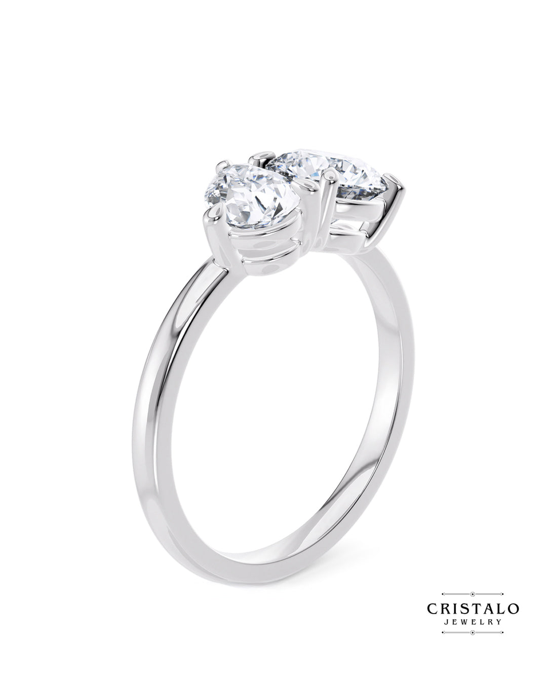 A perfect symbol of unity: The Toi et Moi ring, showcasing a pear and a round diamond linked in a tender embrace on a white gold band.