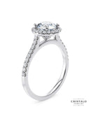 Aphrodite halo engagement ring with an oval-cut diamond in 18k white gold.