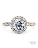 The Aphrodite halo engagement ring with a round-cut diamond in 18k yellow gold. The ring features a Castle setting with a total diamond weight of approx. 0.31ct.