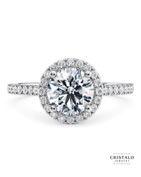 A stunning Aphrodite oval-cut diamond halo ring, radiating elegance in 18k white gold.