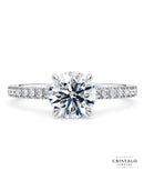 A classic 18k white gold diamond band ring, designed to perfectly fit a wedding band.