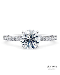 A classic 18k white gold diamond band ring, designed to perfectly fit a wedding band.
