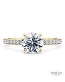 The Aria diamond band engagement ring with an oval-cut diamond in 18k yellow gold. Features a 1.70mm band with a Castle setting.