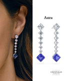 Astra diamond and tanzanite drop earrings in 18k white gold. An elegant piece with a total carat weight of 3.97ct and a Claw setting.