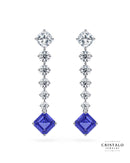 The Astra linear diamond drop earrings with a tanzanite gemstone in 18k white gold. This piece has a total carat weight of approx. 3.97ct and a Claw setting.