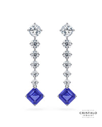 The Astra linear diamond drop earrings with a tanzanite gemstone in 18k white gold. This piece has a total carat weight of approx. 3.97ct and a Claw setting.