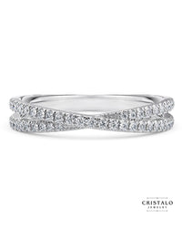 A classic claw-set ring in 18k white gold. The 3.50mm band is adorned with natural diamonds in a Castle setting.