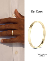 2mm Flat Court wedding band in 18k yellow gold. A modern wedding ring with a sharp edge and a comfortable fit.