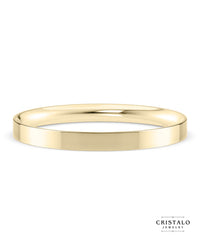 A 2mm Flat Court wedding band in 18k yellow gold. Features a modern flat outer surface and a rounded interior for comfort.