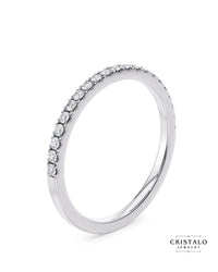 Claw set engagement ring in 18k white gold. Features natural diamonds with a Castle setting for added brilliance.