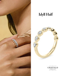 18k yellow gold Idyll ring featuring pear-shaped diamonds. Designer Bezel setting with a total carat weight of 0.35ct.