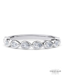 The Idyll ring with a row of pear-shaped diamonds in an 18k white gold Bezel setting. A designer set piece with a total diamond weight of approx. 0.35ct.