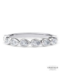 The Idyll ring with a row of pear-shaped diamonds in an 18k white gold Bezel setting. A designer set piece with a total diamond weight of approx. 0.35ct.