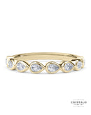 The Idyll ring with a row of pear-shaped diamonds in an 18k yellow gold Bezel setting. A designer set piece with a total diamond weight of approx. 0.35ct.