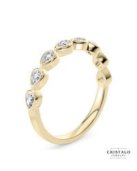 A stunning row of pear-shaped diamonds in the Idyll ring, a perfect complement to the matching Idyll bracelet.