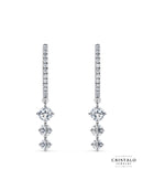 The Lyra diamond drop earrings in 18k white gold. This piece has a total diamond weight of approx. 1.01ct and a Claw setting.