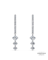 The Lyra diamond drop earrings in 18k white gold. This piece has a total diamond weight of approx. 1.01ct and a Claw setting.