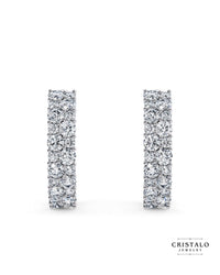 The Orion diamond hoop earrings in 18k white gold. This piece features a cluster of alternating diamonds in a Claw setting, with a total weight of approx. 0.80ct.