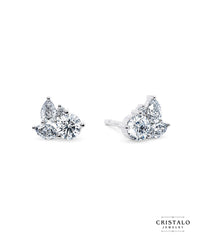 Thalia diamond stud earrings in 18k white gold. A timeless piece with a Claw setting and a total carat weight of 0.65ct.