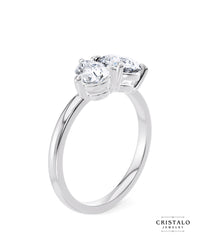 A perfect symbol of unity: The Toi et Moi ring, showcasing a pear and a round diamond linked in a tender embrace on a white gold band.